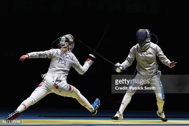 Aleksandra Socha of Poland and Loreta Gulotta of Italy compete during the Women's Individual Sabre on Day 3 of the Rio 2016 Olympic Games at Carioca...