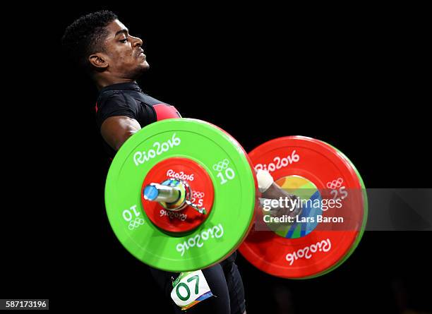 Rick Yves Confiance of Seychelles competes during the Men's 62kg Group B weightlifting contest on Day 3 of the Rio 2016 Olympic Games at the...