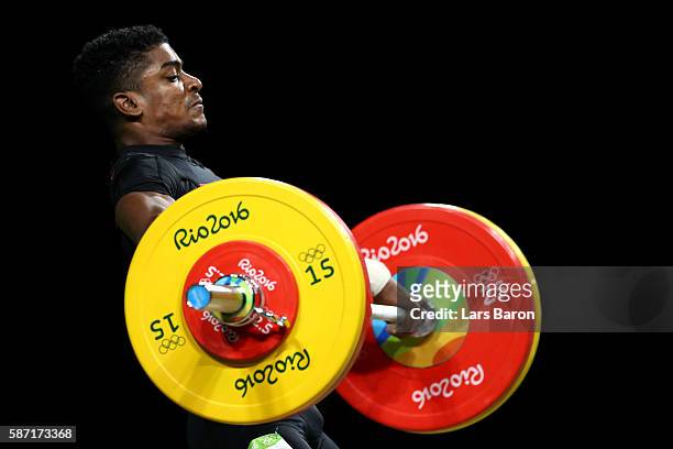 Rick Yves Confiance of Seychelles competes during the Men's 62kg Group B weightlifting contest on Day 3 of the Rio 2016 Olympic Games at the...