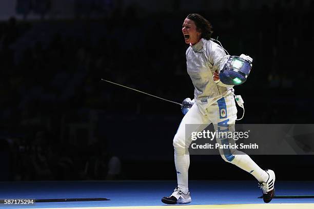 Loreta Gulotta of Italy celebrates victory over Aleksandra Socha of Poland during the Women's Individual Sabre on Day 3 of the Rio 2016 Olympic Games...