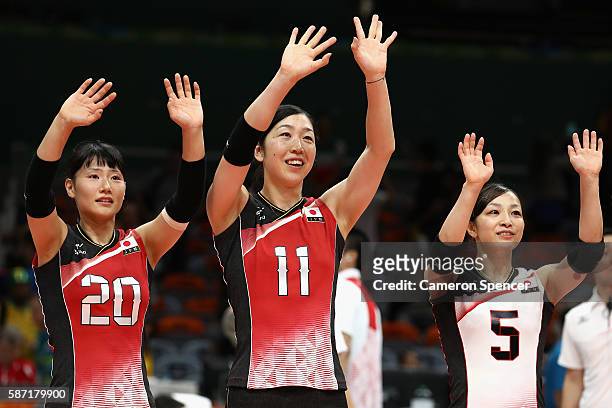 Kanami Tashiro, Erika Araki and Arisa Sato of Japan thank the crowd after winning the Women's Preliminary Pool A match between Japan and Cameroon on...