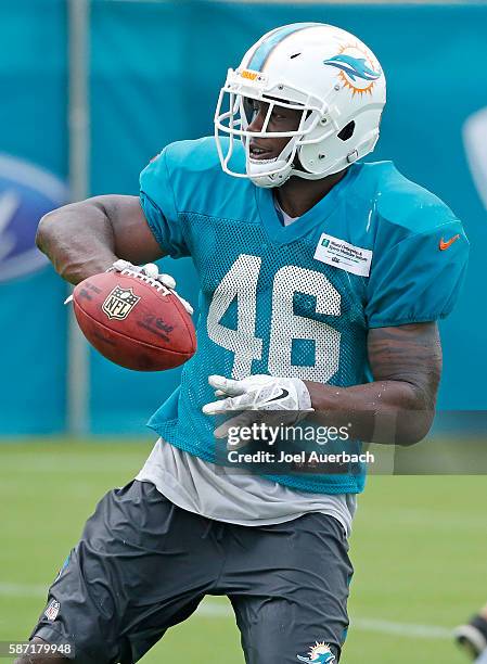 Neville Hewitt of the Miami Dolphins makes a one handed catch of the ball during the teams training camp on August 8, 2016 at the Miami Dolphins...