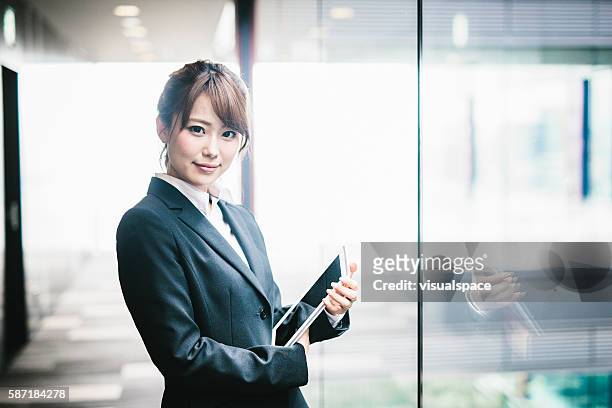 portrait of a young japanese business woman - japanese woman stock pictures, royalty-free photos & images