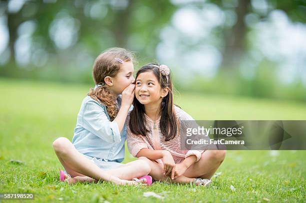whispering secrets - secrets stock pictures, royalty-free photos & images