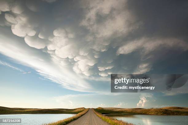 mammatus storm clouds saskatchewan - saskatchewan stock pictures, royalty-free photos & images