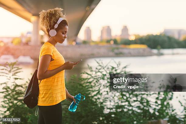 latina runner - walking side view stock pictures, royalty-free photos & images