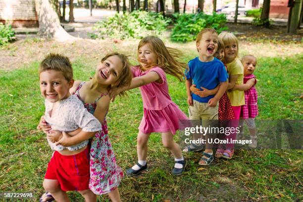 cute children playing at park - toddler playing stock pictures, royalty-free photos & images