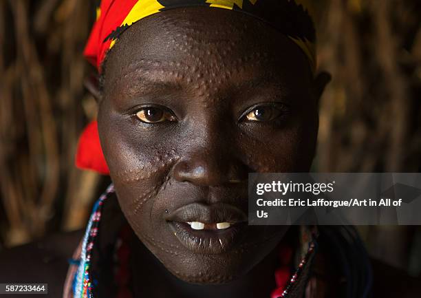 Toposa tribe woman with scarified face, omo valley, kangate, Ethiopia on March 15, 2016 in Kangate, Ethiopia.