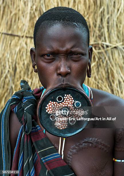 Amursi tribeswoman wearing a traditional lip-plate, omo valley, mago park, Ethiopia on March 18, 2016 in Mago Park, Ethiopia.