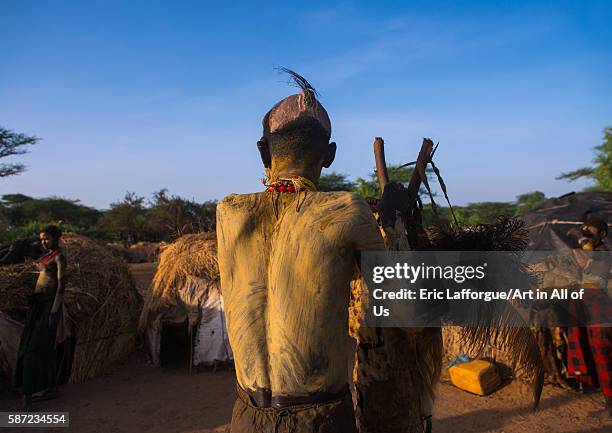 Dassanech man preparing himself for dimi ceremony to celebrate circumcision of teenagers, omo valley, omorate, Ethiopia on March 21, 2016 in Omorate,...