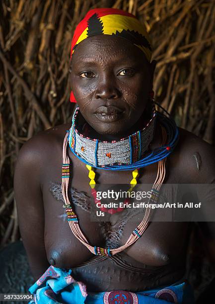 Toposa tribe woman with scarified face, omo valley, kangate, Ethiopia on March 15, 2016 in Kangate, Ethiopia.