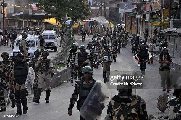 Indian Paramilitary forces March towards there base camps after lifting the curfew in old city srinagar on August 8,2016.The protests have entered...