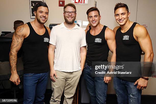 Actor Seth Rogen poses for photos with Australian male revue, Thunder from Down Under, at the SiriusXM Studios on August 8, 2016 in New York City.