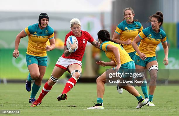 Jennifer Kish of Canada gets tackled during the Women's Semi Final 1 Rugby Sevens match between Australia and Canada on Day 3 of the Rio 2016 Olympic...