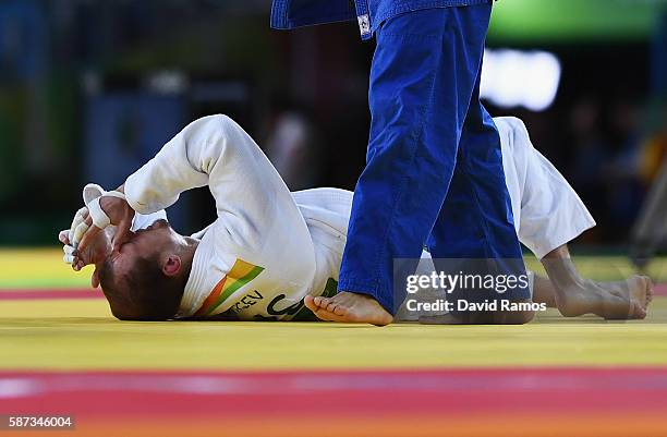 Denis Iartcev of Russia reacts being defeated by Lasha Shavdatuashvili of Georgia in the Men's -73 kg Repechage contest on Day 3 of the Rio 2016...