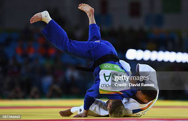 Nicholas Delpopolo of the United States competes against Miklos Ungvari of Hungary in the Men's -73 kg Repechage contest on Day 3 of the Rio 2016...