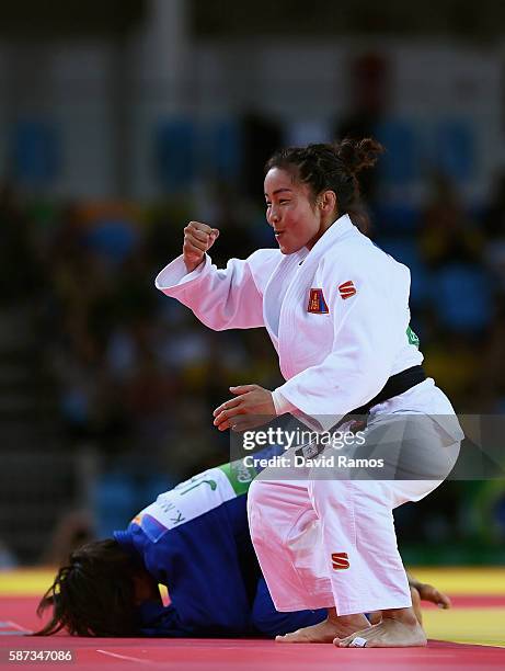 Sumiya Dorjsuren of Mongolia celebrates after defeating Kaori Matsumoto of Japan in the Women's -57 kg Semifinal of Table A Judo contest on Day 3 of...