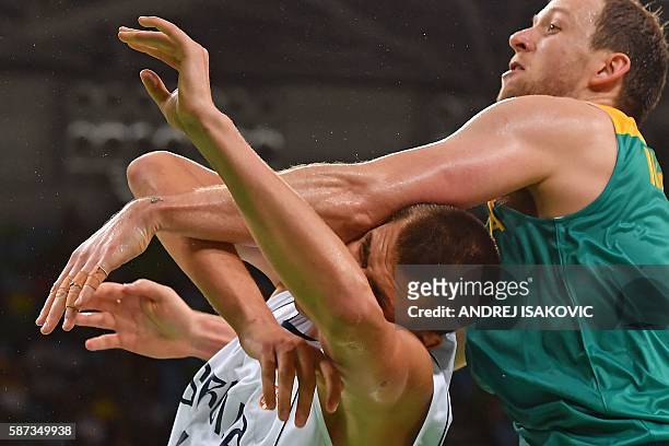 Serbia's power forward Nikola Jokic collides with Australia's small forward Joe Ingles during a Men's round Group A basketball match between Serbia...
