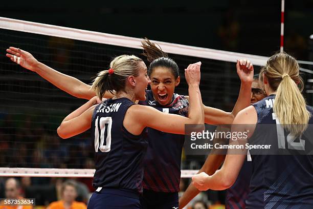 Jordan Larson-Burbach of United States and Alisha Glass of United States celebrate a point during the Women's Preliminary Pool B match between the...