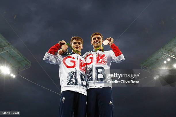 Bronze medalists Daniel Goodfellow and Tom Daley of Great Britain celebrate on the podium during the medal ceremony for the Men's Diving Synchronised...