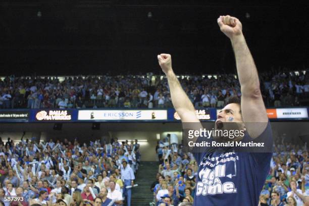 Owner Mark Cuban of the Dallas Mavericks celebrates in game three of round one in the NBA playoffs against the Utah Jazz at Reunion Arena in Dallas,...