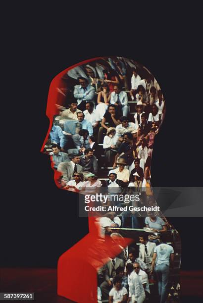 Spectators at an event projected onto a mannequin head, 1987.