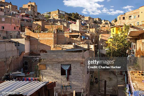 looking into mexican favela housing on hillside - mexico slums stock pictures, royalty-free photos & images
