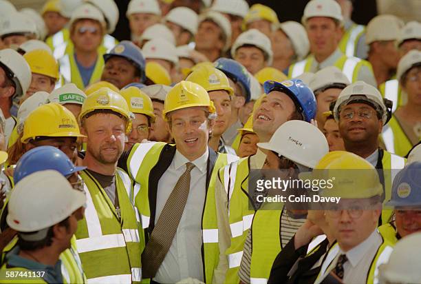 British Prime Minister Tony Blair attends the builder's rite of 'topping out' as the Millennium Dome reaches completion, London, 22nd June 1998.