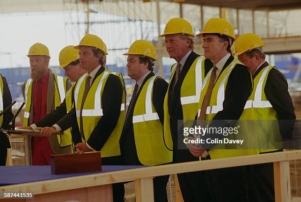 British Prime Minister Tony Blair attends the builder's rite of 'topping out' as the Millennium Dome reaches completion, London, 22nd June 1998. With...