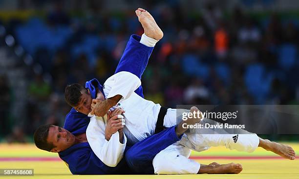 Dirk van Tichelt of Belgium competes against Miklos Ungvari of Hungary in the Men's -73 kg Contest for Bronze Medal B on Day 3 of the Rio 2016...