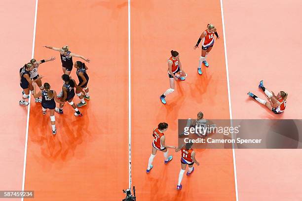 United States players celebrats a point during the Women's Preliminary Pool B match between the Netherlands and the United States on Day 3 of the Rio...