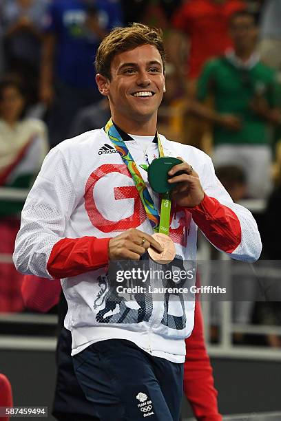 Bronze medalist Tom Daley of Great Britain celebrates during the medal ceremony for the Men's Diving Synchronised 10m Platform Final on Day 3 of the...