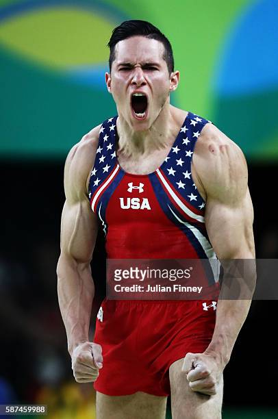 Alexander Naddour of the United States reacts after competing on the vault during the men's team final on Day 3 of the Rio 2016 Olympic Games at the...