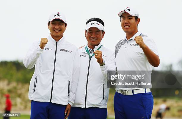 Team leader K.J. Choi of South Korea poses with his players Jeung-hun Wang and Byeong-hun An during a practice round during Day 3 of the Rio 2016...