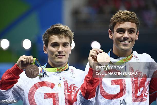Great Britain's Thomas Daley and Great Britain's Daniel Goodfellow celebrate with their bronze medal during the podium ceremony for the Men's...