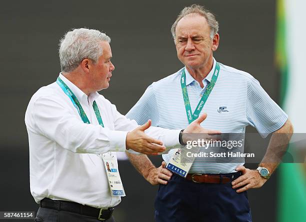 International Golf Federation Vice President Ty Votaw and President Peter Dawson wait on a green during a practice round during Day 3 of the Rio 2016...