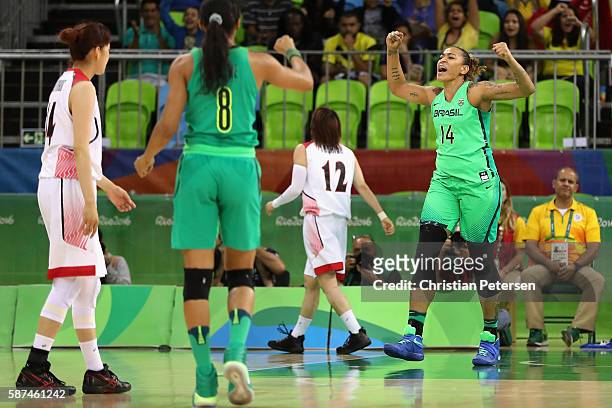 Erika Couza of Brazil celebrates after scoring against Japan during the women's basketball game on Day 3 of the Rio 2016 Olympic Games at the Youth...