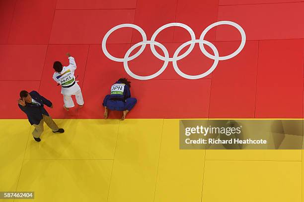 Sumiya Dorjsuren of Mongolia celebrates defeating Kaori Matsumoto of Japan in the Women's -57 kg Semifinal of Table A on Day 3 of the Rio 2016...