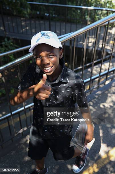 Dillion, a local Chicago member of Big Brothers, Big Sisters, anticipates the thrill of a roller coaster ride at Six Flags Great America on August 8,...