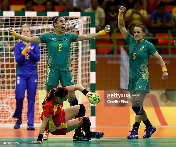 Fabiana Diniz and Daniela Piedade of Brazil celebrate a defensive play against Romania on Day 3 of the Rio 2016 Olympic Games at the Future Arena on...