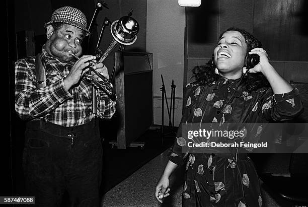 Deborah Feingold/Corbis via Getty Images) NEW YORK Jazz trumpet player Dizzy Gillespie with singer Chaka Khan recording 'A Night in Tunis' in...