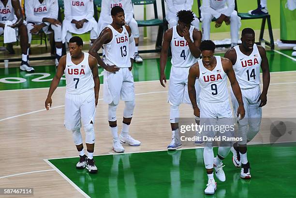Kyle Lowry, Paul George, Jimmy Butler, Demar DeRozan and Draymond Green of United States walk on the court during the Men's Preliminary Round between...