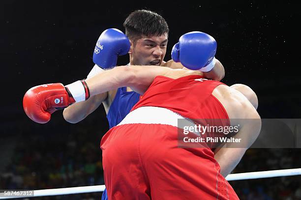 Vassiliy Levit of Kazakhstan fights against Fengkai Yu of China blue) in their Mens 91kg Heavyweight bout on Day 3 of the Rio 2016 Olympic Games at...