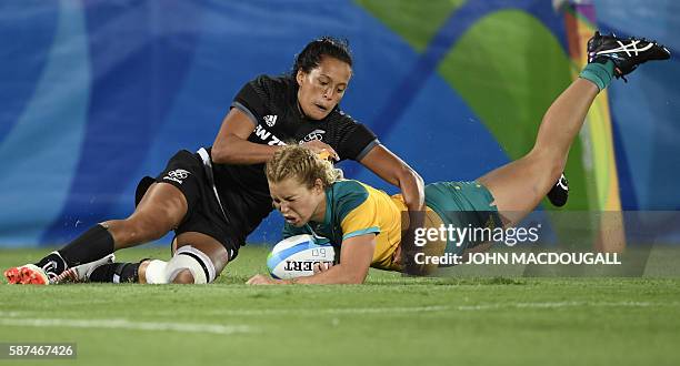 Australia's Emma Tonegato scores a try in the womens rugby sevens gold medal match between New Zealand and Australia during the Rio 2016 Olympic...