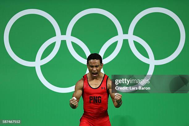 Morea Baru of Papua New Guinea reacts during the Men's 62kg Group A weightlifting contest on Day 3 of the Rio 2016 Olympic Games at the Riocentro -...