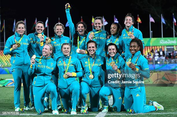 Gold medalist team Australia celebrate with their gold medal after the medal ceremony for the Women's Rugby Sevens on Day 3 of the Rio 2016 Olympic...