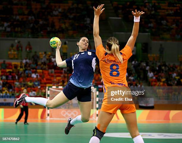 Macarena Gandulfo of Argentina takes a shot as Lois Abbingh of Netherlands defends on Day 3 of the Rio 2016 Olympic Games at the Future Arena on...