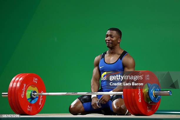 Oscar Albeiro Figueroa Mosquera of Colombia reacts during the Men's 62kg Group A weightlifting contest on Day 3 of the Rio 2016 Olympic Games at the...