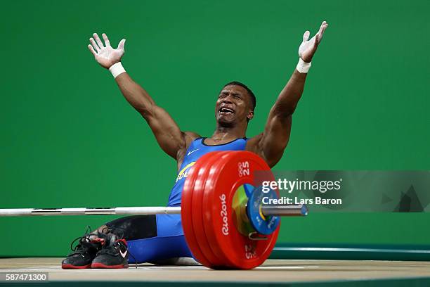 Oscar Albeiro Figueroa Mosquera of Colombia reacts during the Men's 62kg Group A weightlifting contest on Day 3 of the Rio 2016 Olympic Games at the...