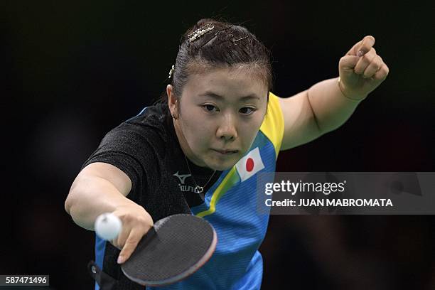 Japan's Ai Fukuhara plays against North Korea's Ri Myong Sun during their women's singles qualification round table tennis match at the Riocentro...